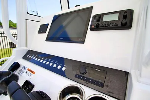 Slide: The Image of 2024 Regulator 23 boat dashboard with modern navigation and control systems. - 14