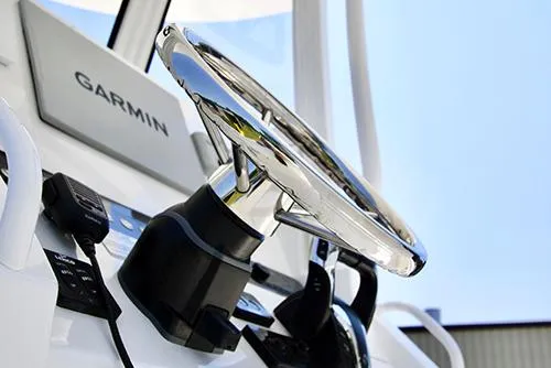 Slide: The Image of Close-up of 2024 Regulator 23 boat steering wheel and Garmin navigation system. - 9