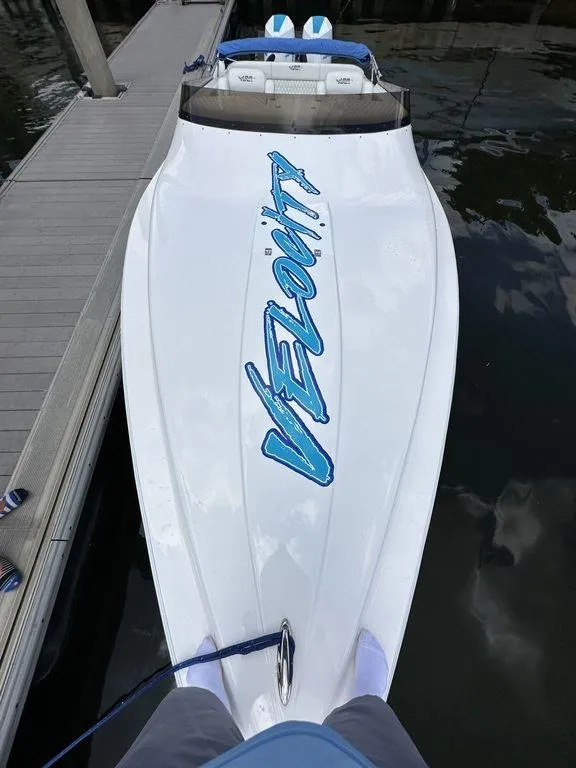 Slide: The Image of 2024 Velocity 290sc speedboat docked, top view. - 12