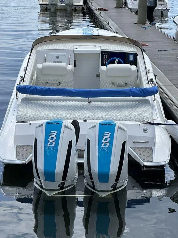 Slide: The Image of 2024 Velocity 290sc speedboat with twin 300 horsepower engines docked at marina. - 26