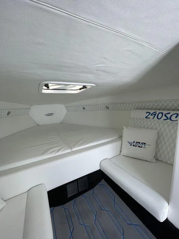 Slide: The Image of 2024 Velocity 290SC boat interior with white upholstery and logo detailing. - 30