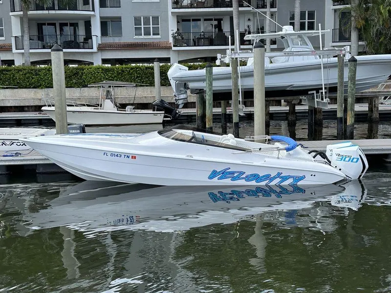 Slide: The Image of 2024 Velocity 290sc speedboat docked in marina. - 31