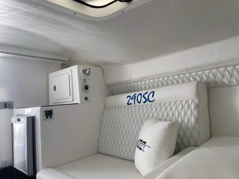 Slide: The Image of 2024 Velocity 290SC cabin interior with white upholstery and compact amenities. - 32