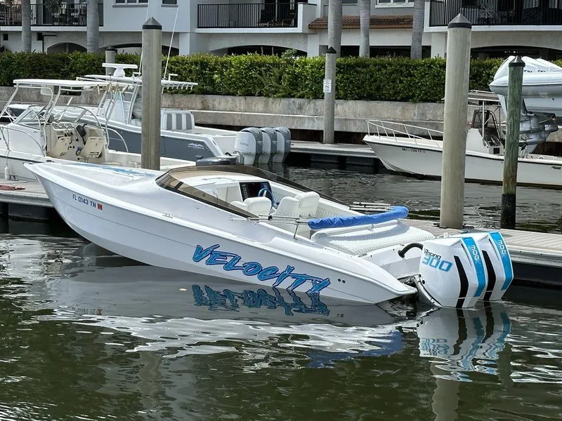 Slide: The Image of 2024 Velocity 290sc speedboat docked at marina. - 33