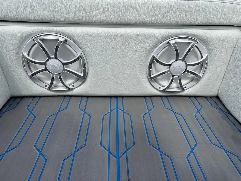 Slide: The Image of 2024 Velocity 290sc boat interior with dual speakers and stylish flooring. - 5