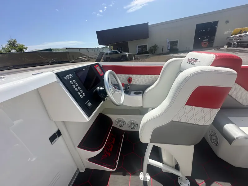 Slide: The Image of 2025 Velocity 290 SC boat interior with modern dashboard and stylish seating. - 20