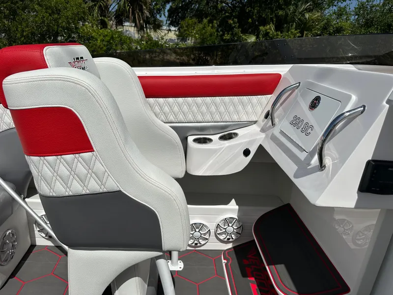 Slide: The Image of Interior of 2025 Velocity 290 SC boat with red and white seating, sleek design. - 22