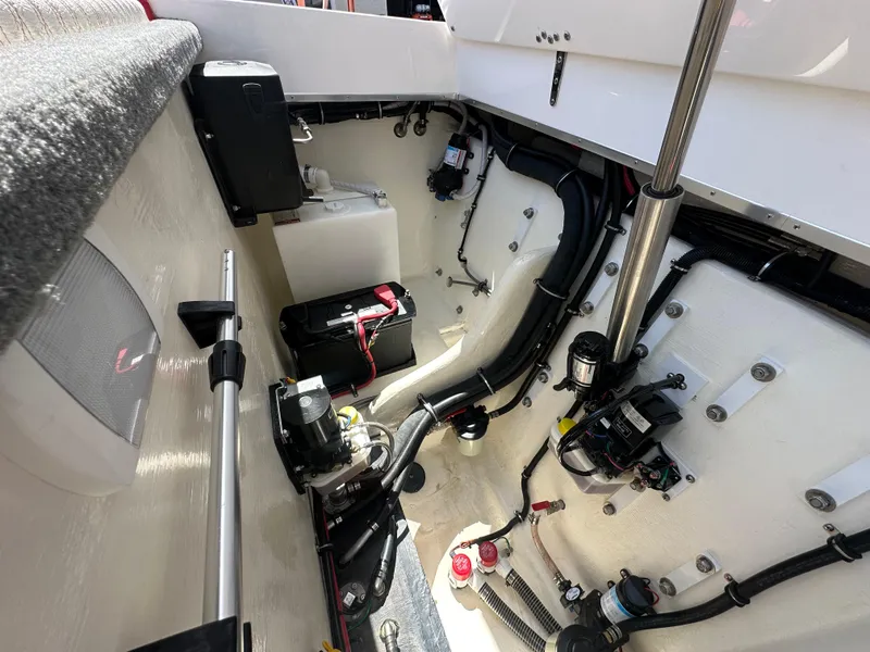 Slide: The Image of Engine compartment of 2025 Velocity 290 SC boat, showcasing wiring and components. - 32