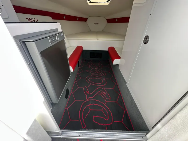 Slide: The Image of 2025 Velocity 290 SC cabin interior with seating, fridge, and custom flooring. - 37