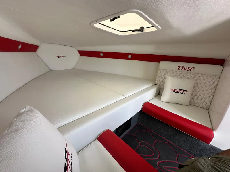 Slide: The Image of 2025 Velocity 290 SC cabin interior with white and red upholstery, featuring branded cushions. - 39