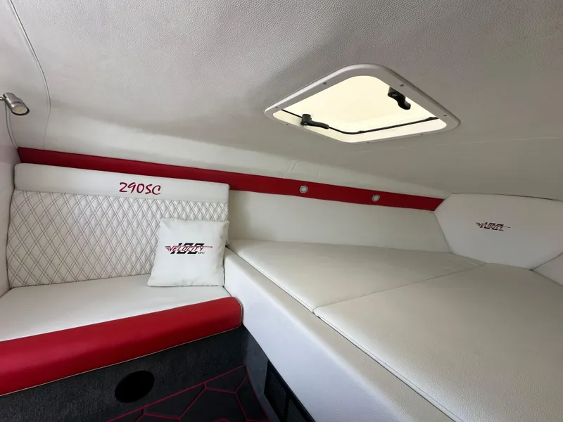 Slide: The Image of Interior of 2025 Velocity 290 SC boat with white and red seating. - 41
