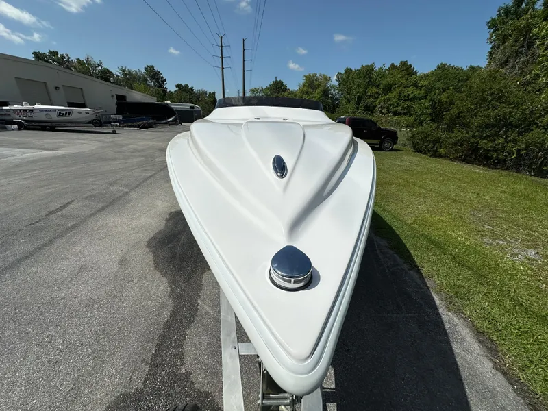 Slide: The Image of 2025 Velocity 290 SC boat on trailer, sleek design, outdoor setting. - 6