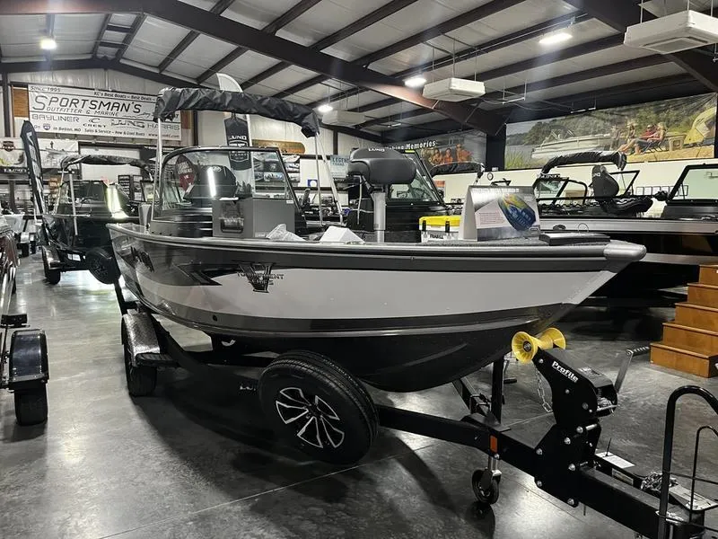 The Image of 2024 Lund 1875 Pro V Sport boat on display in showroom. - 1
