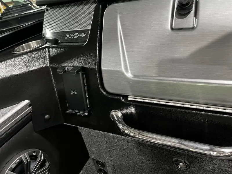 Slide: The Image of 2024 Lund 1875 Pro V Sport boat interior, featuring sleek black and silver design. - 10