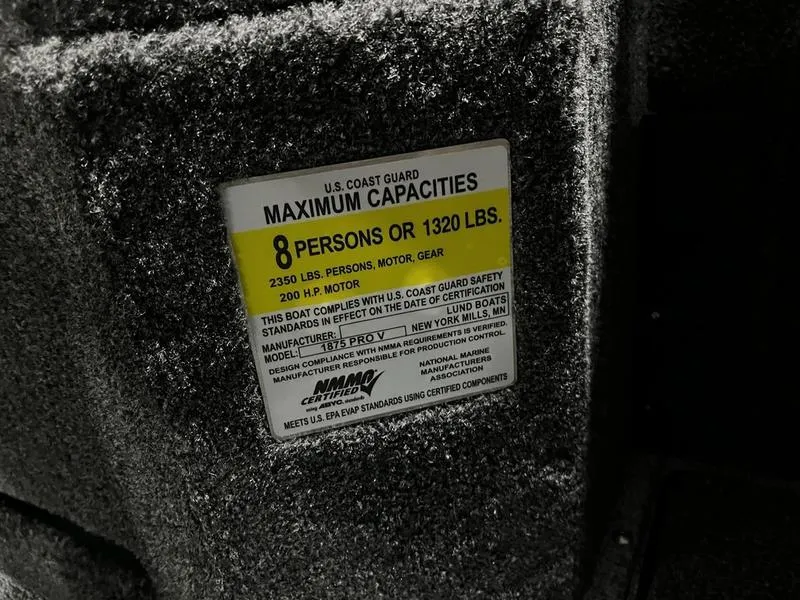 Slide: The Image of 2024 Lund 1875 Pro V Sport boat capacity label, 8 persons or 1320 lbs, 200 HP motor. - 11