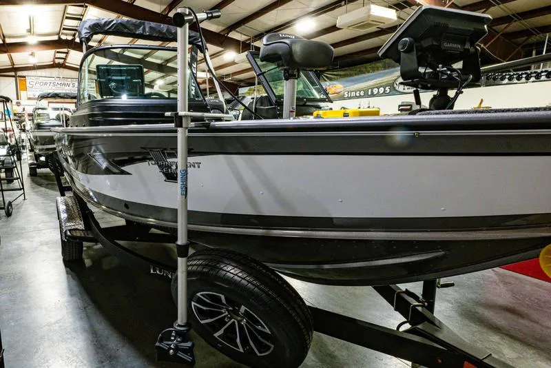 Slide: The Image of 2024 Lund 1875 Pro V Sport fishing boat in showroom. - 15