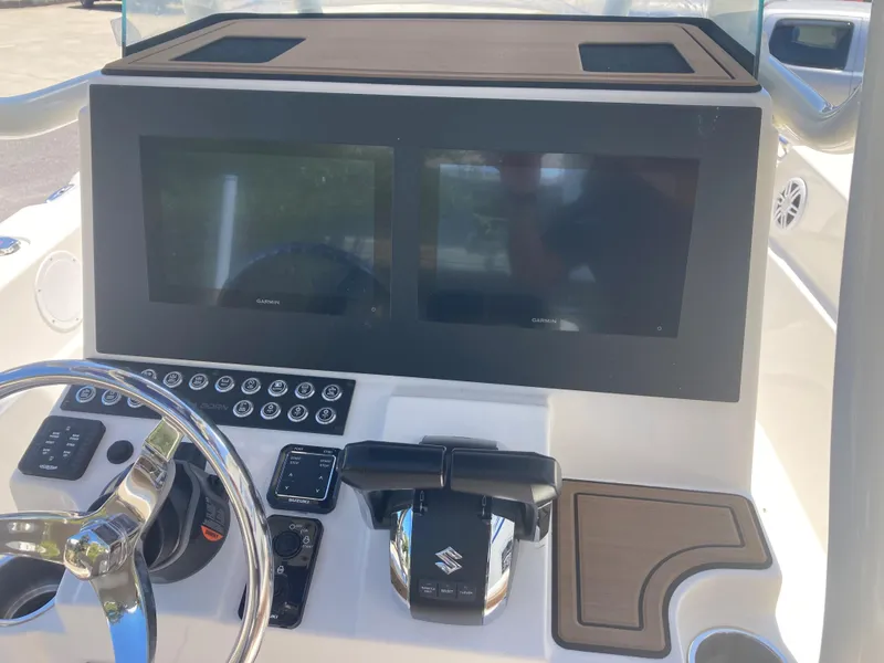 Slide: The Image of 2024 Sea Born LX24 boat dashboard with dual screens and controls. - 8