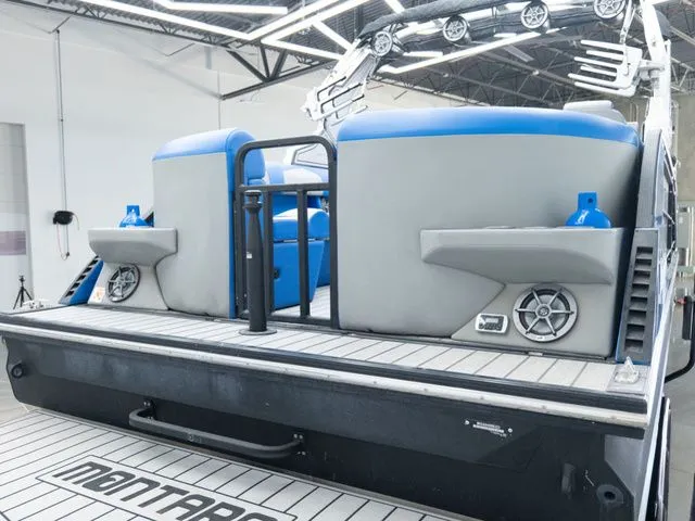 Slide: The Image of 2023 Montara 25' SURF BOSS 2.0 CW boat rear in a showroom. - 18