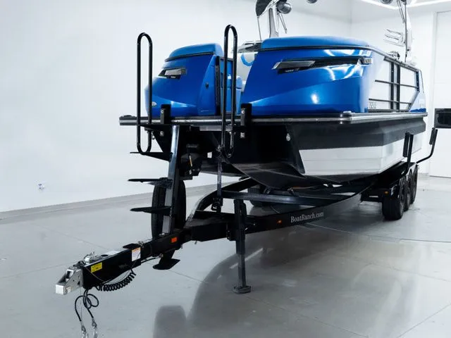 Slide: The Image of 2023 Montara 25' SURF BOSS 2.0 CW boat on trailer. - 2