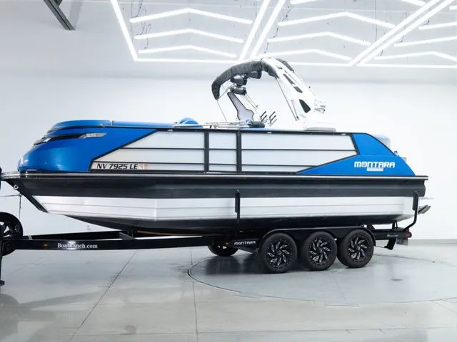 Slide: The Image of 2023 Montara 25' SURF BOSS 2.0 CW boat on trailer in garage. - 6
