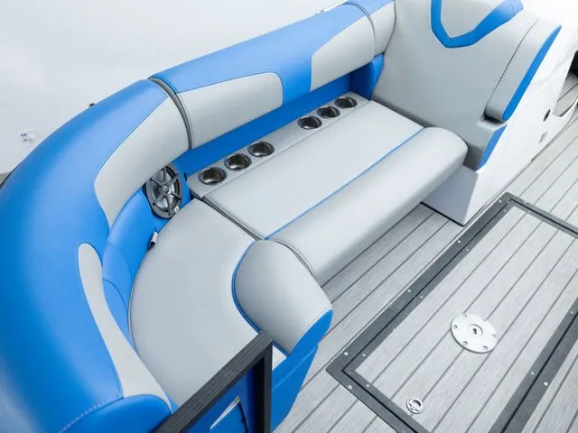 Slide: The Image of Interior of 2023 Montara 25' SURF BOSS 2.0 CW with blue and gray seating. - 7
