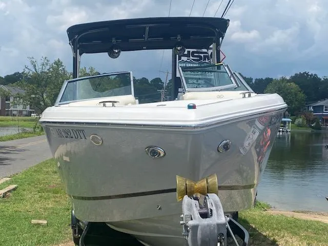 Slide: The Image of 2021 Cobalt R5 boat on a trailer near a lake, front view. - 3