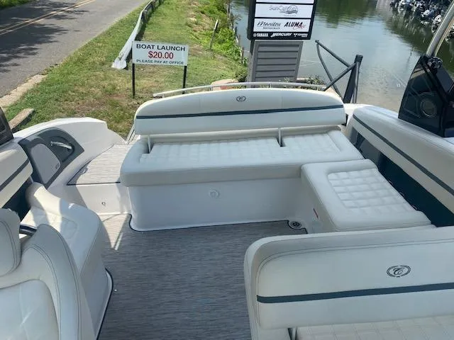 Slide: The Image of 2021 Cobalt R5 boat interior with white seating and a view of the dock. - 8