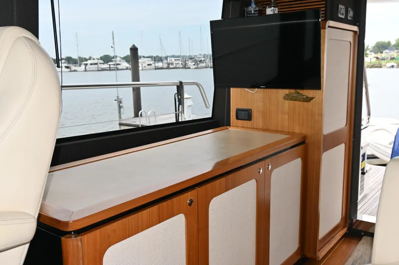 Slide: The Image of Interior of 2014 Azimut Magellano 50 yacht with wooden cabinetry and mounted TV. - 11
