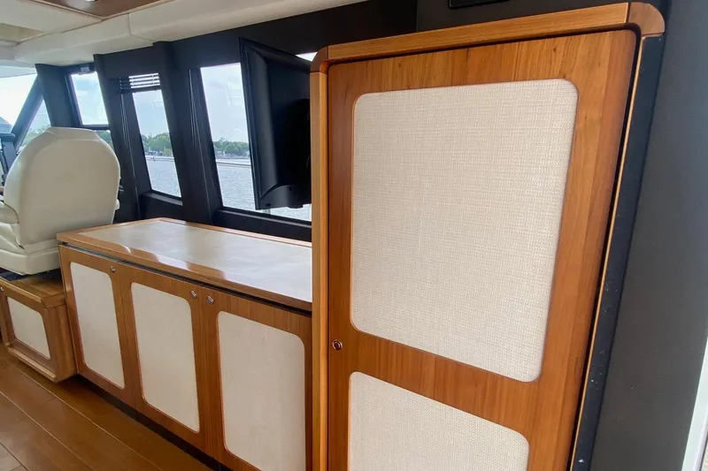 Slide: The Image of Interior of 2014 Azimut Magellano 50 yacht with wood paneling and large windows. - 12