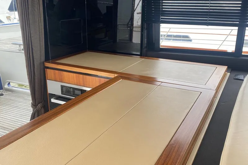 Slide: The Image of Interior of 2014 Azimut Magellano 50 yacht with elegant wood and leather finishes. - 15