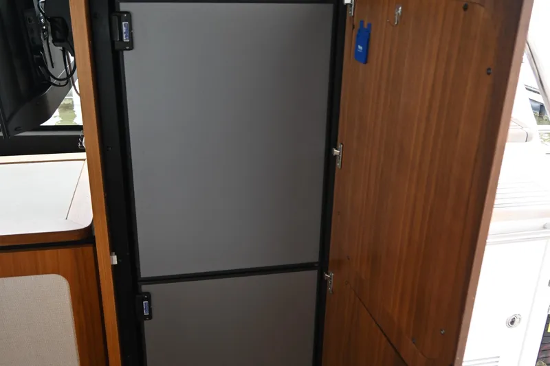 Slide: The Image of Interior view of 2014 Azimut Magellano 50 yacht featuring a sleek, modern refrigerator. - 20