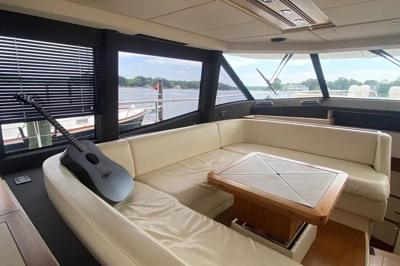 Slide: The Image of Luxurious interior of 2014 Azimut Magellano 50 yacht with leather seating and guitar. - 24