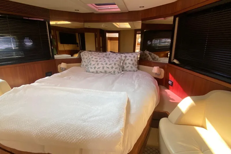 Slide: The Image of Luxurious bedroom interior of 2014 Azimut Magellano 50 yacht with cozy bedding. - 27