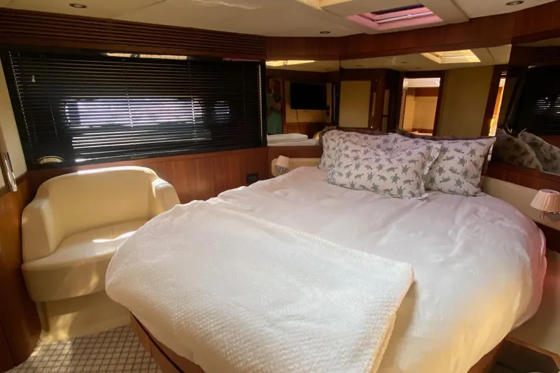 Slide: The Image of Luxurious bedroom interior of 2014 Azimut Magellano 50 yacht with cozy bedding. - 28