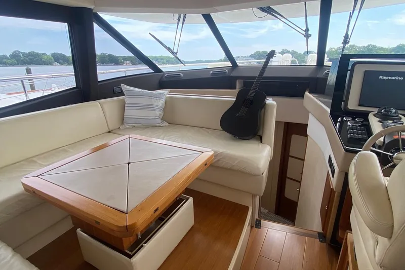 Slide: The Image of Luxurious interior of 2014 Azimut Magellano 50 yacht with seating and guitar. - 3