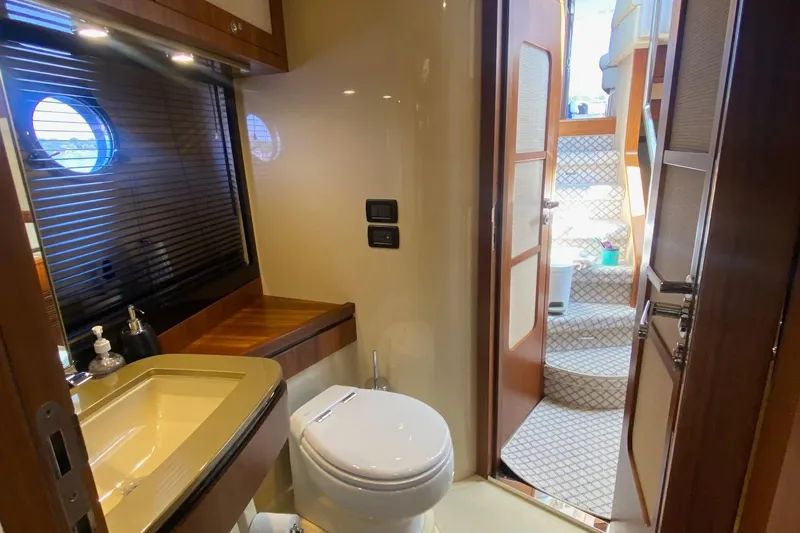 Slide: The Image of Luxurious bathroom on 2014 Azimut Magellano 50 yacht with modern fixtures and wooden accents. - 31