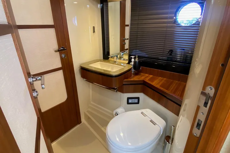 Slide: The Image of Luxurious bathroom in 2014 Azimut Magellano 50 yacht with modern fixtures and wooden accents. - 32