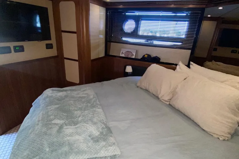 Slide: The Image of Luxurious bedroom interior of 2014 Azimut Magellano 50 yacht with cozy bedding. - 35