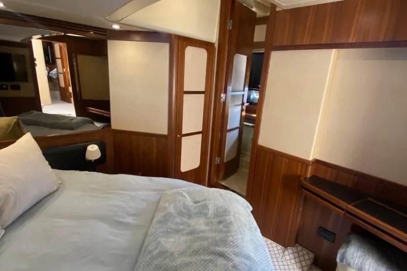 Slide: The Image of Interior of 2014 Azimut Magellano 50 yacht with cozy bedroom and wooden accents. - 37