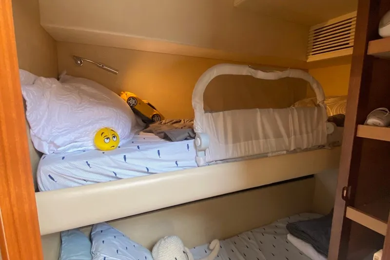 Slide: The Image of Cozy bunk beds in 2014 Azimut Magellano 50 yacht cabin with playful decor. - 42
