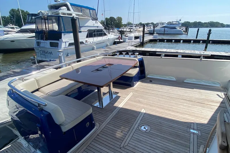 Slide: The Image of Azimut Magellano 50 yacht, 2014 model, featuring spacious deck with seating and table. - 43