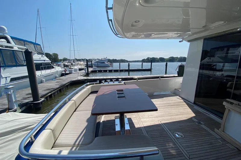 Slide: The Image of Azimut Magellano 50 yacht deck, 2014 model, docked at marina with scenic water view. - 44