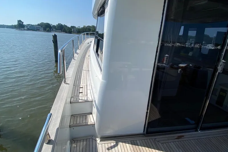 Slide: The Image of Azimut Magellano 50 yacht deck, 2014 model, docked by calm waters. - 45