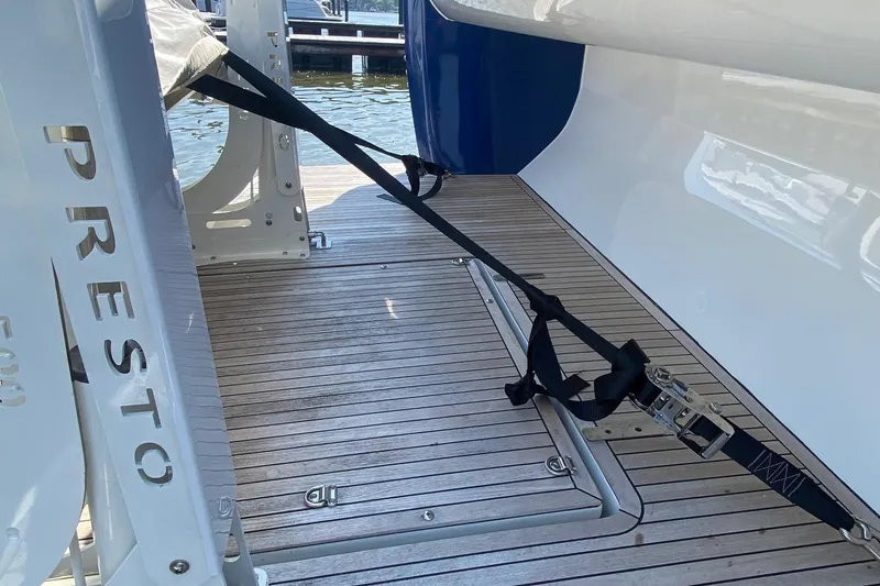 Slide: The Image of Azimut Magellano 50 yacht, 2014 model, with secure mooring strap on wooden deck. - 46