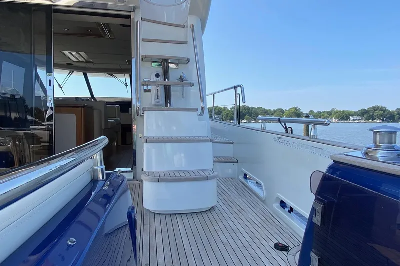 Slide: The Image of Azimut Magellano 50 yacht deck, 2014 model, with elegant wood flooring and scenic water view. - 47