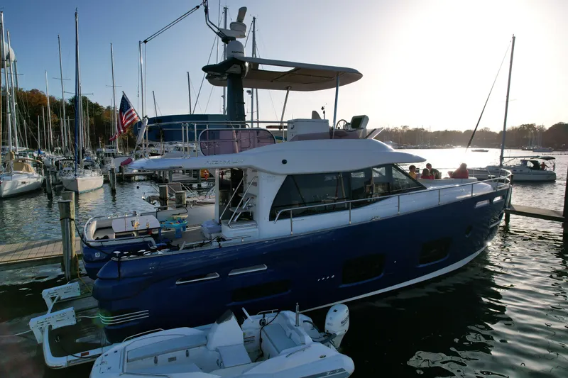 Slide: The Image of Azimut Magellano 50 yacht docked at marina, 2014 model, with sunset in background. - 6