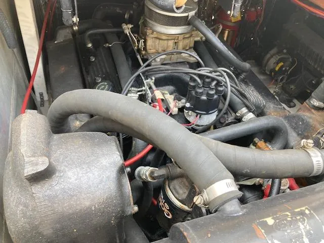 Slide: The Image of 1990 Bayliner 3288 Motoryacht engine compartment with visible hoses and components. - 16