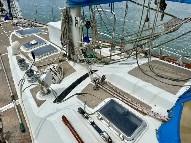 Slide: The Image of 1983 Norseman 447 CC Cutter sailboat deck with rigging and hatches. - 30