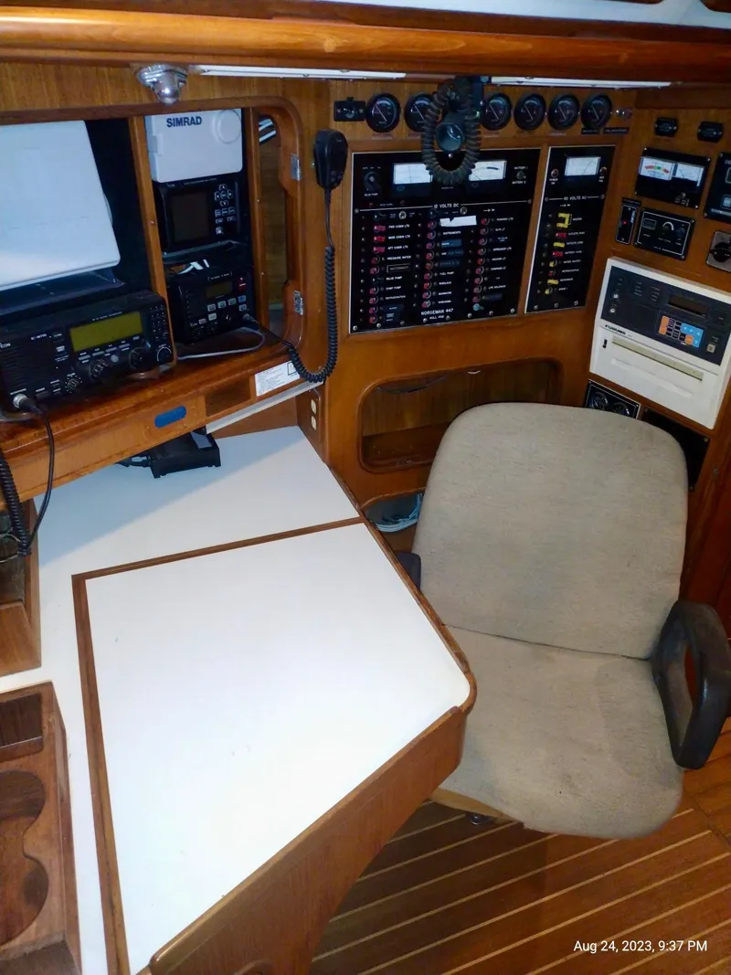 Slide: The Image of Navigation station of 1983 Norseman 447 CC Cutter with control panels and equipment. - 5
