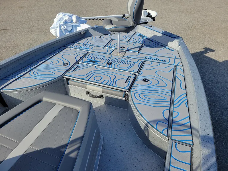 Slide: The Image of 2024 Xpress X23 Bay Lounge boat interior with stylish seating and deck design. - 14